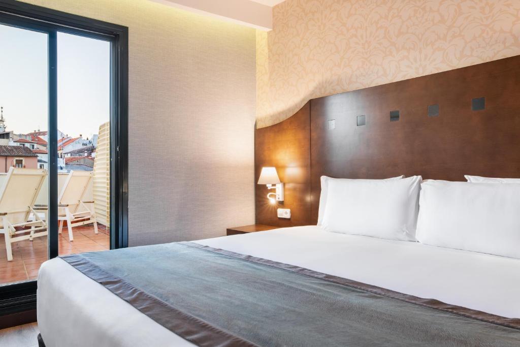 Habitación doble Premium del hotel Exe Agora Caceres. Foto 1