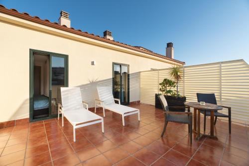 Habitación Premium con Terraza del hotel Exe Agora Caceres. Foto 3