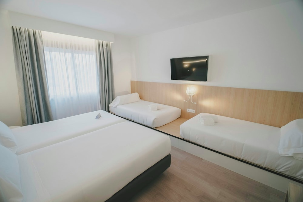 Habitación Familiar del hotel Sercotel Carlos Iii. Foto 3