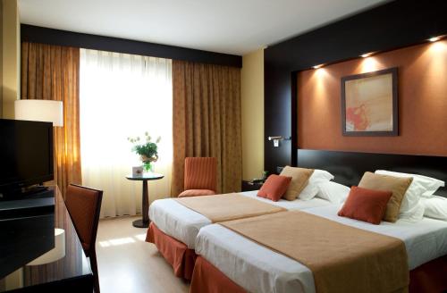 Habitación Triple del hotel Intelier Rosa. Foto 1