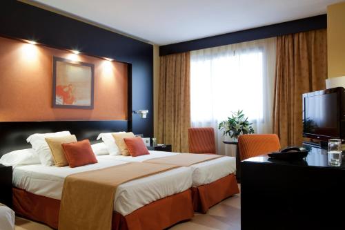 Habitación Triple del hotel Intelier Rosa. Foto 2