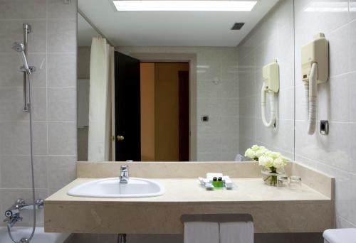 Habitación Triple del hotel Intelier Rosa. Foto 3