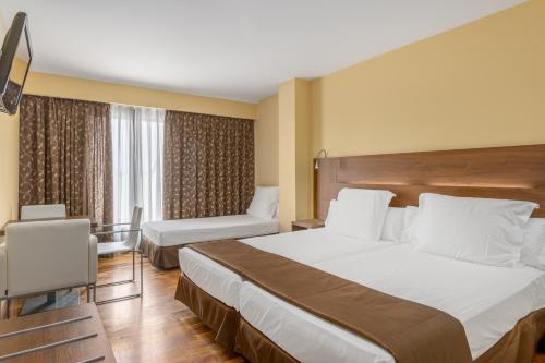 Habitación Triple del hotel Exe Doña Carlota