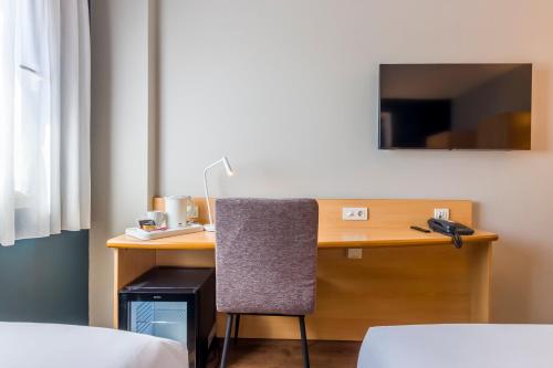 Habitación Triple del hotel Travelodge Madrid Alcalá de Henares. Foto 4