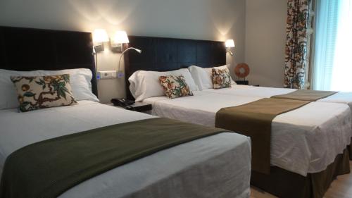 Habitación Triple del hotel Moderno