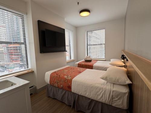 Habitación Estándar con baño compartido - 2 camas del hotel Americana Inn