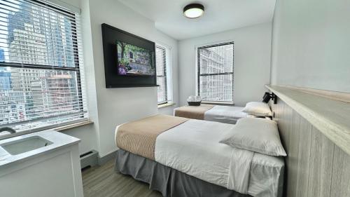 Habitación Estándar con baño compartido - 2 camas del hotel Americana Inn. Foto 11