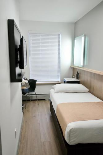 Habitación Individual Estándar con baño compartido del hotel Americana Inn. Foto 9