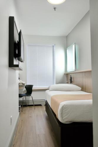 Habitación Individual Estándar con baño compartido del hotel Americana Inn. Foto 10