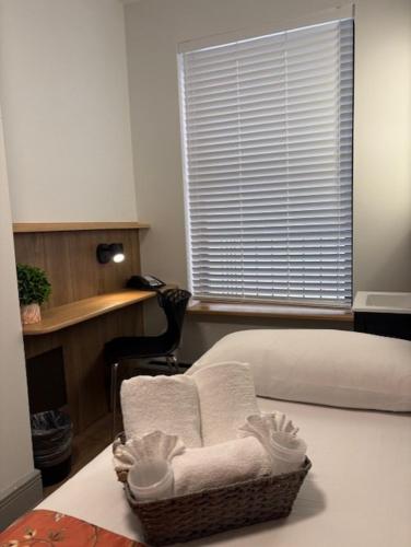 Habitación Individual Estándar con baño compartido del hotel Americana Inn. Foto 12