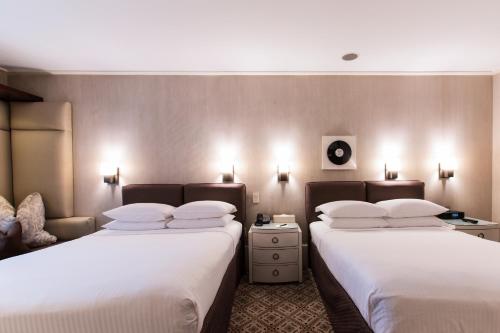 Habitación Doble Deluxe 2 camas dobles del hotel City Club. Foto 3