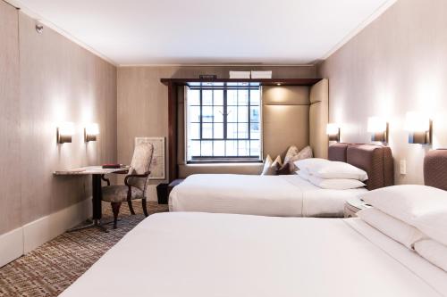 Habitación Doble Deluxe 2 camas dobles del hotel City Club. Foto 1