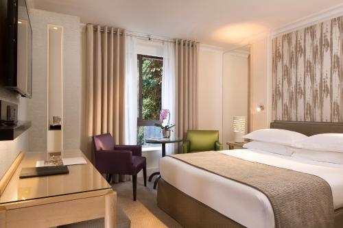 Habitación Clásica del hotel Garden Elysee. Foto 1