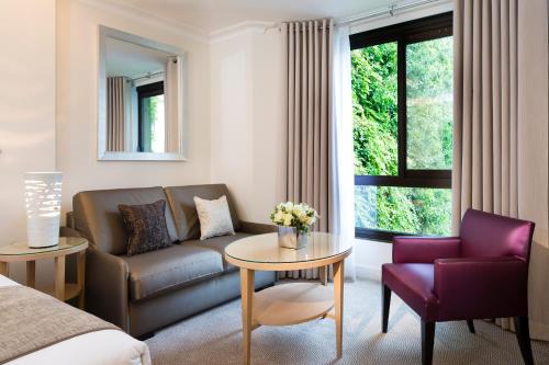 Junior suite Lujo 1 Cama queen Premium Sofá Cama incluido del hotel Garden Elysee. Foto 3