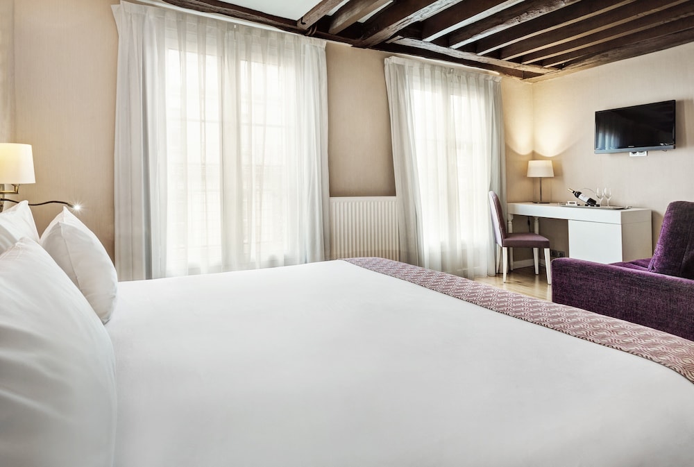 Habitación con 1 cama doble o 2 individuales del hotel Exe Paris Centre. Foto 1