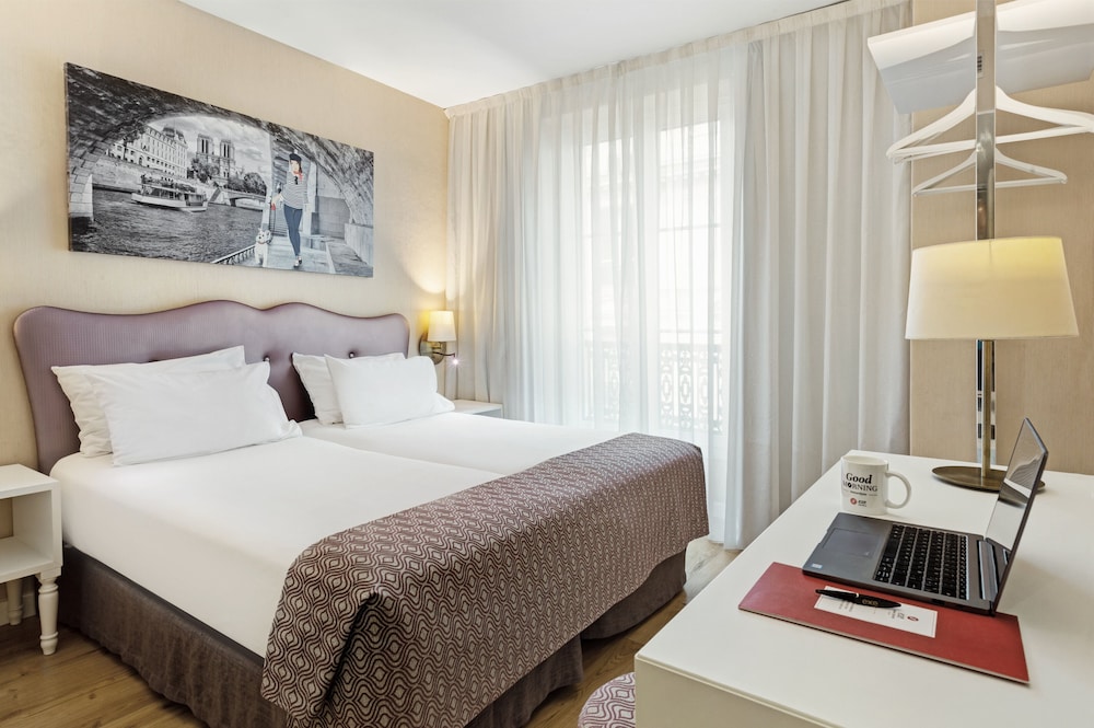 Habitación con 1 cama doble o 2 individuales del hotel Exe Paris Centre. Foto 4