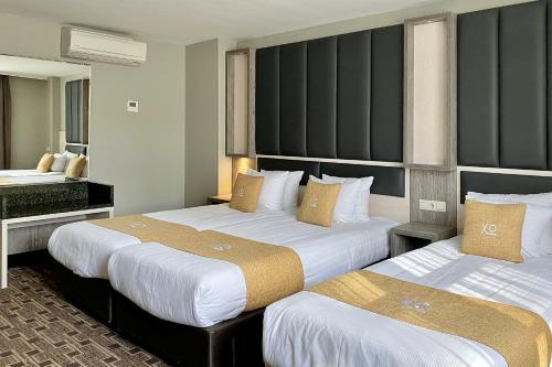 Habitación Triple - Sótano del hotel Xo Hotels City Centre. Foto 3