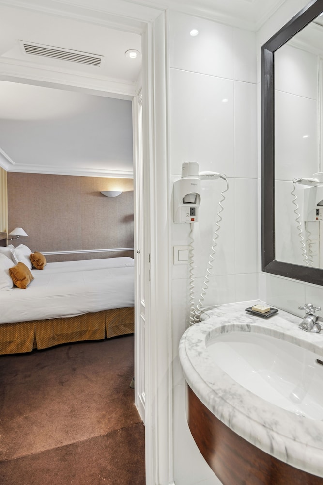 Habitación Deluxe con 2 camas individuales, 2 camas individuales del hotel Victoires Opera. Foto 1