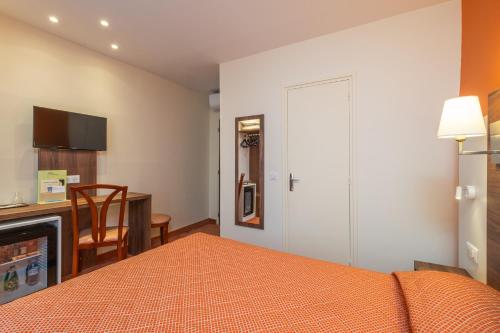 Habitación Clásica - Sin ascensor del hotel Terminus Montparnasse. Foto 2