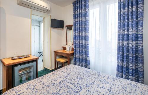 Habitación Individual Confort del hotel Terminus Montparnasse. Foto 1