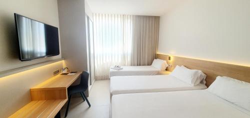 Habitación Triple Deluxe del hotel Areca. Foto 3
