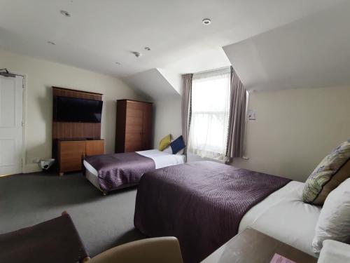 Habitación Triple del hotel Blue Bells. Foto 7