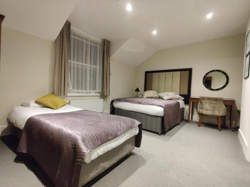 Habitación Triple del hotel Blue Bells. Foto 21