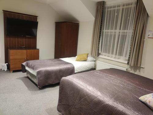 Habitación cuádruple del hotel Blue Bells. Foto 9