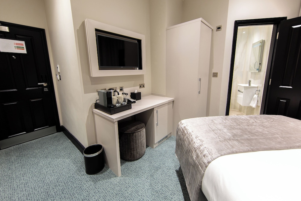 Habitación Deluxe con 2 camas individuales del hotel The Crescent Hyde Park. Foto 5