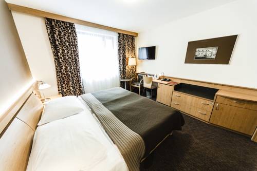 Habitación Triple del hotel Archibald City