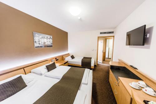 Habitación Triple del hotel Archibald City. Foto 4