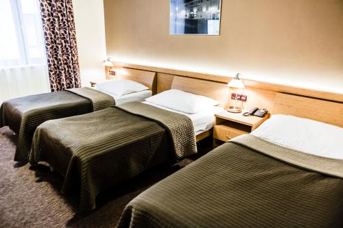 Habitación Triple del hotel Archibald City. Foto 6