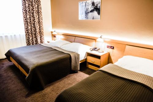 Habitación Triple del hotel Archibald City. Foto 7