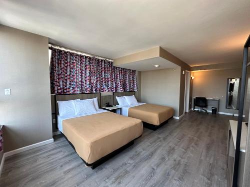 Suite Deluxe Queen del hotel Regal Inn and Suites New York LaGuardia. Foto 10