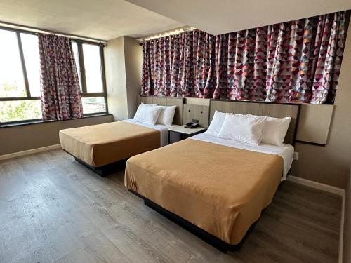 Suite Deluxe Queen del hotel Regal Inn and Suites New York LaGuardia. Foto 11