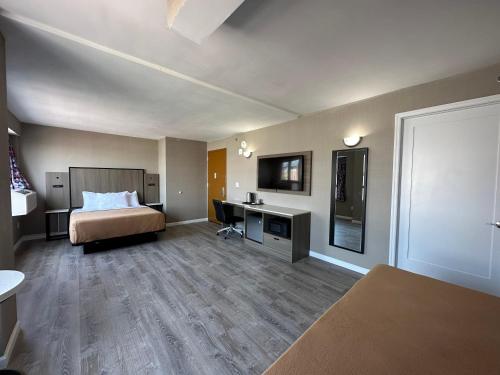 Suite Deluxe Queen del hotel Regal Inn and Suites New York LaGuardia. Foto 13