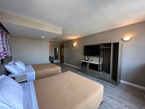 Suite Deluxe Queen del hotel Regal Inn and Suites New York LaGuardia. Foto 15