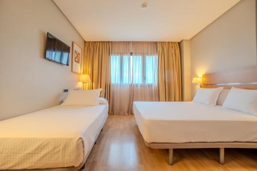 Habitación Doble con cama supletoria - 1 o 2 camas del hotel Reston Valdemoro. Foto 1