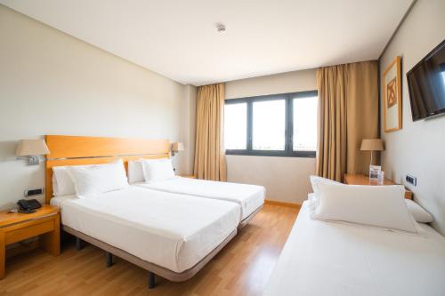 Habitación Doble con cama supletoria - 1 o 2 camas del hotel Reston Valdemoro. Foto 4