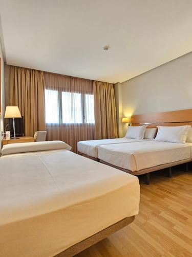 Habitación Doble con cama supletoria - 1 o 2 camas del hotel Reston Valdemoro. Foto 2