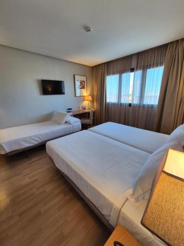 Habitación Doble con cama supletoria - 1 o 2 camas del hotel Reston Valdemoro. Foto 4