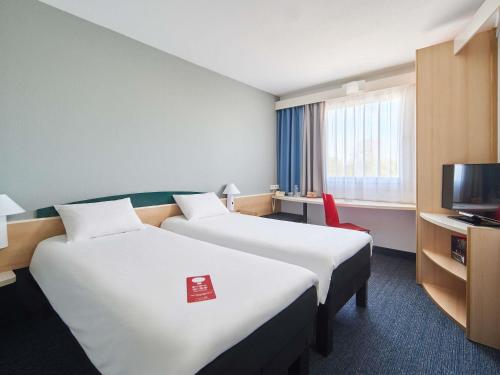 Habitación Doble - 2 camas del hotel Ibis Czestochowa. Foto 6