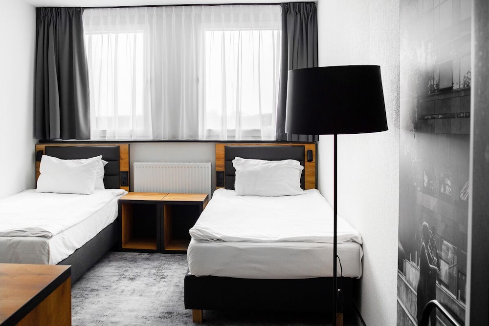 Habitación Superior con Dos Camas Individuales del hotel Mercure Opole. Foto 1