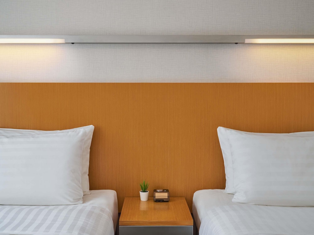 Habitación estándar, 2 camas individuales del hotel Novotel Century Hong Kong. Foto 1