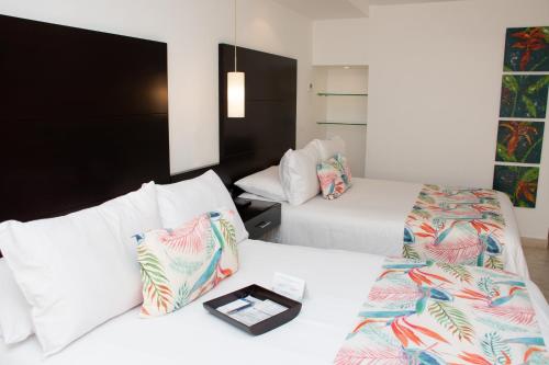 Habitación Doble Superior - 2 camas dobles del hotel Capilla Del Mar