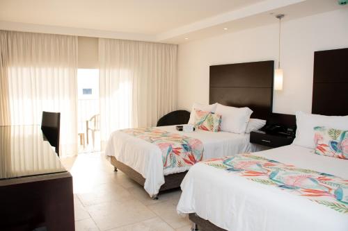 Habitación Doble Superior - 2 camas dobles del hotel Capilla Del Mar. Foto 3
