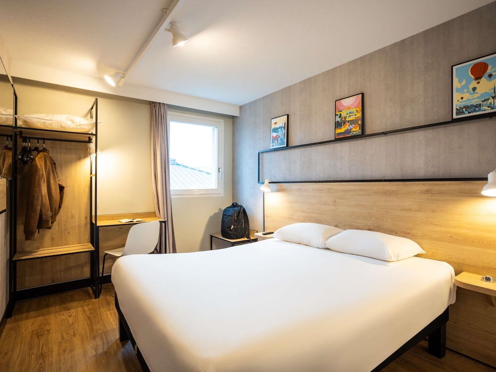 Habitación familiar, varias camas del hotel Ibis Angouleme Nord. Foto 1