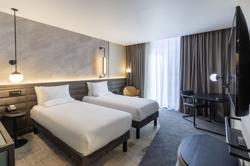 Habitación superior (2 single beds and sofa) del hotel Novotel Rotterdam Brainpark. Foto 1