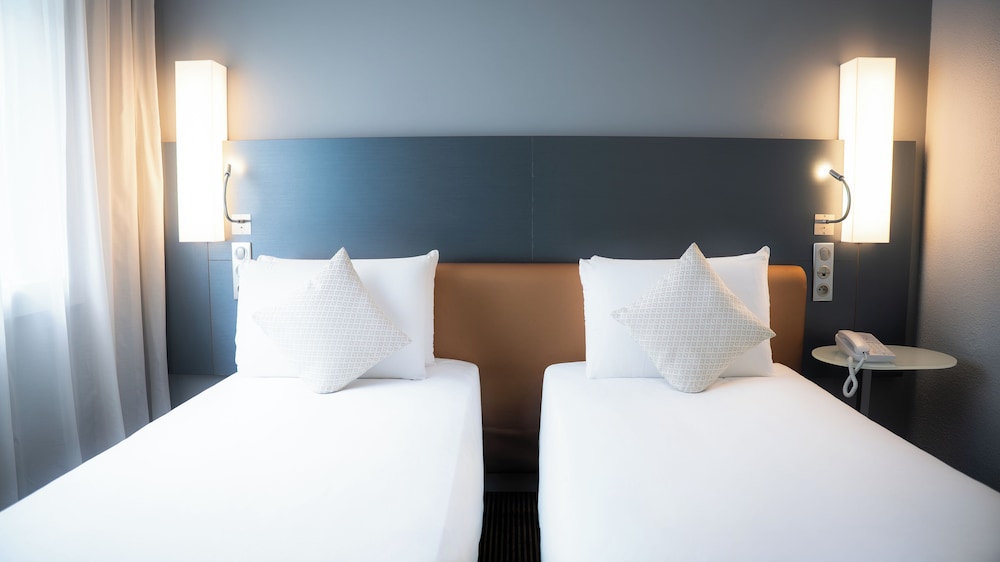 Habitación Clásica con camas individuales del hotel Mercure Paris Massy Gare TGV. Foto 1
