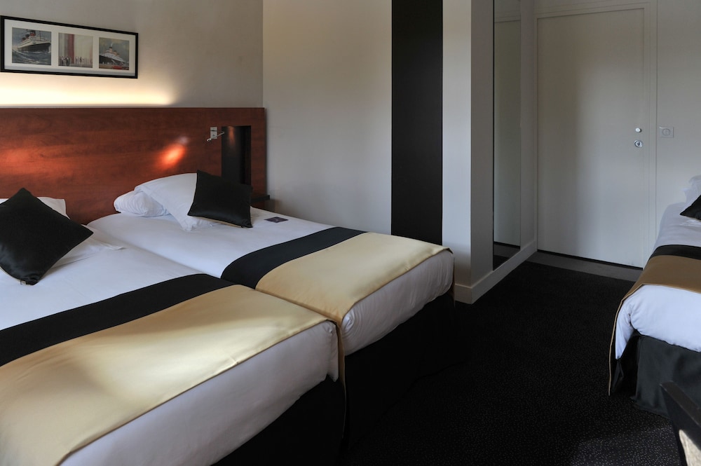 Habitación Triple del hotel Mercure Maurepas Saint Quentin. Foto 1